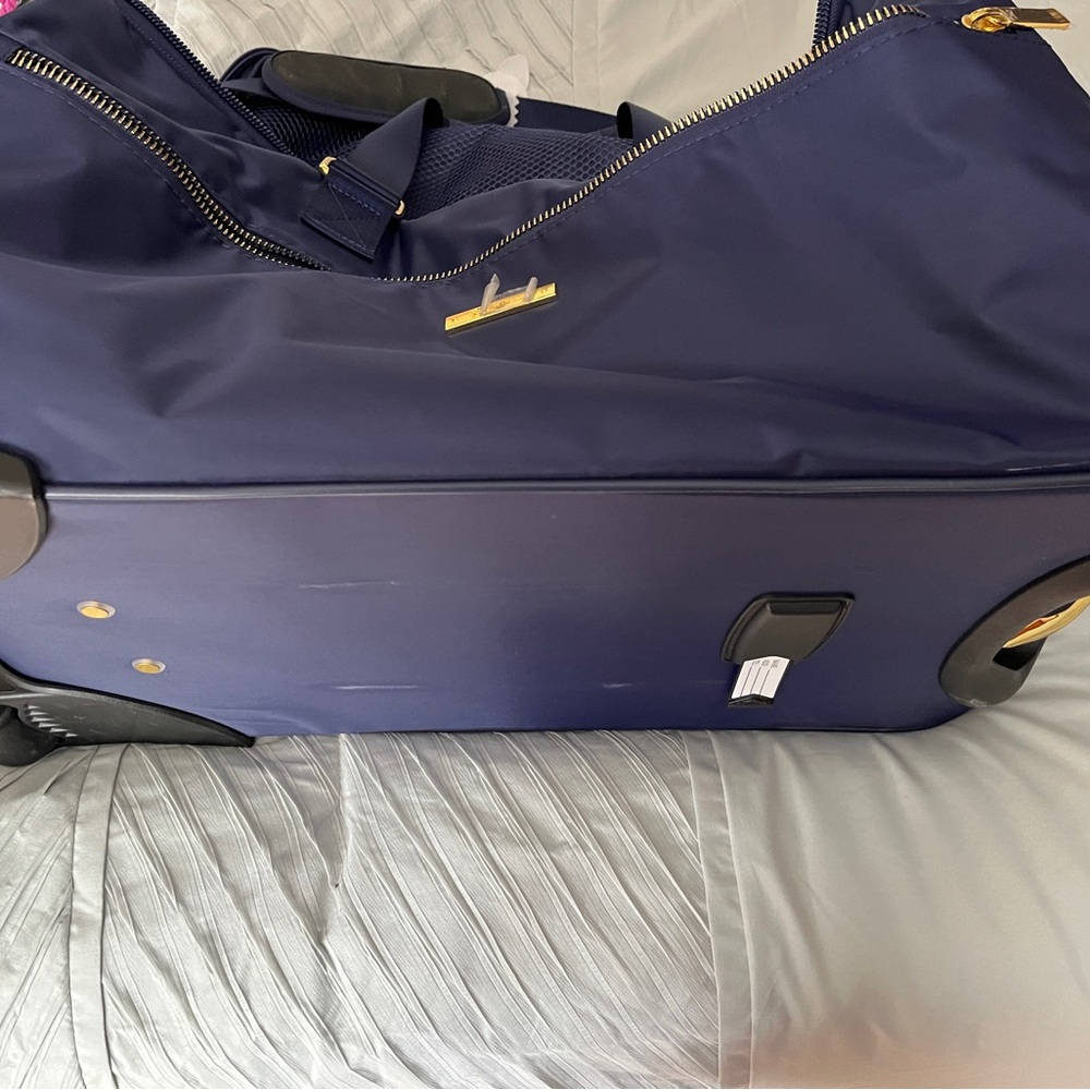 Joy Mangano duffle and tote barely used. Signs of wear.